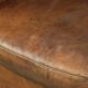 Vintage sheepskin club armchair finished with decorative nails