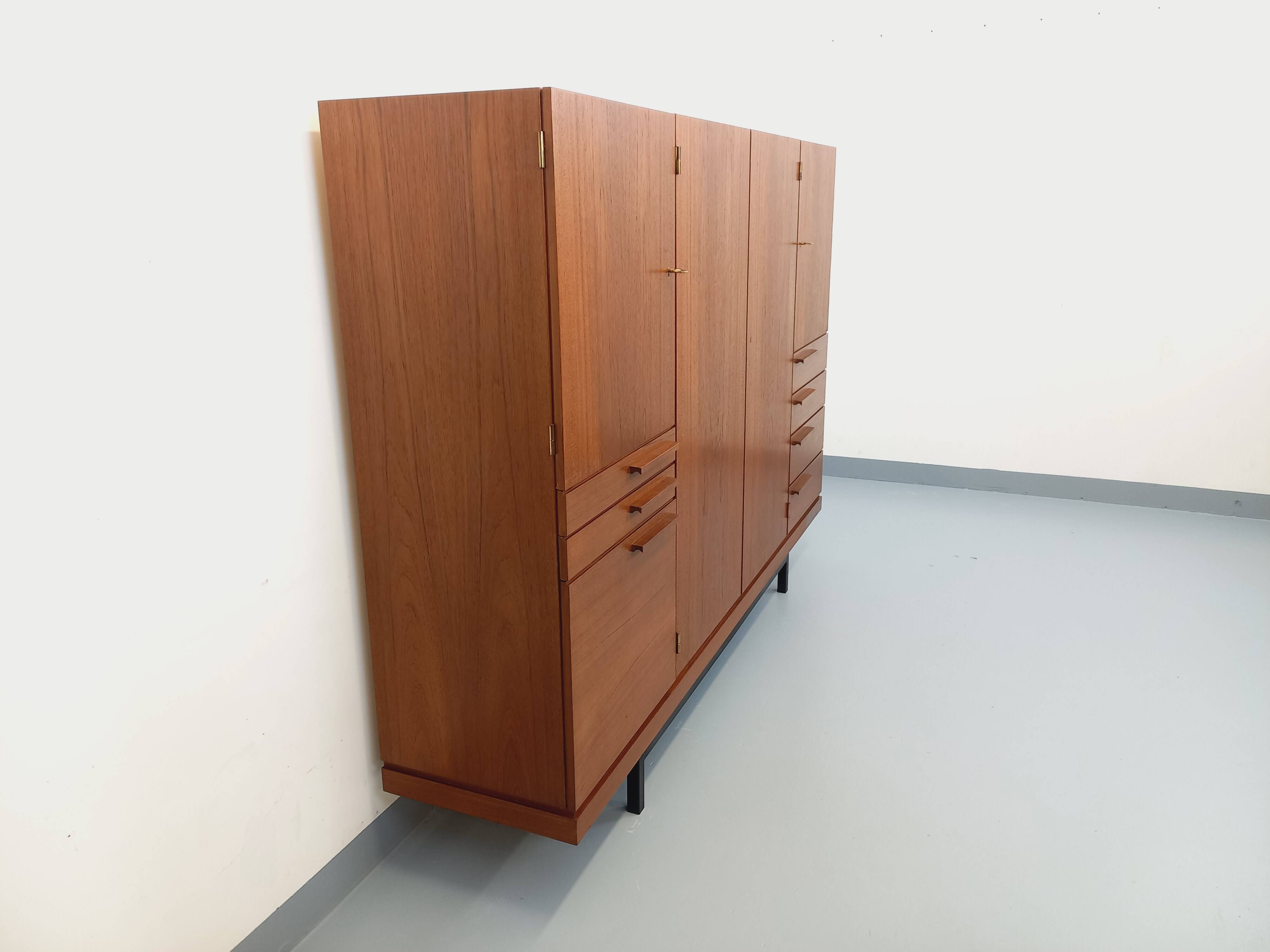 High Scandinavian modernist vintage sideboard in teak and black metal.