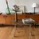 Green and brass trolley on wheels