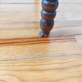 Antique corner chair made of turned wood spindle.