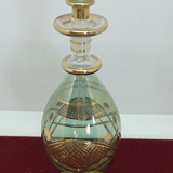 Vial / perfume bottle in tinted and cut glass golden border