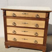 Old chest of drawers with white marble.