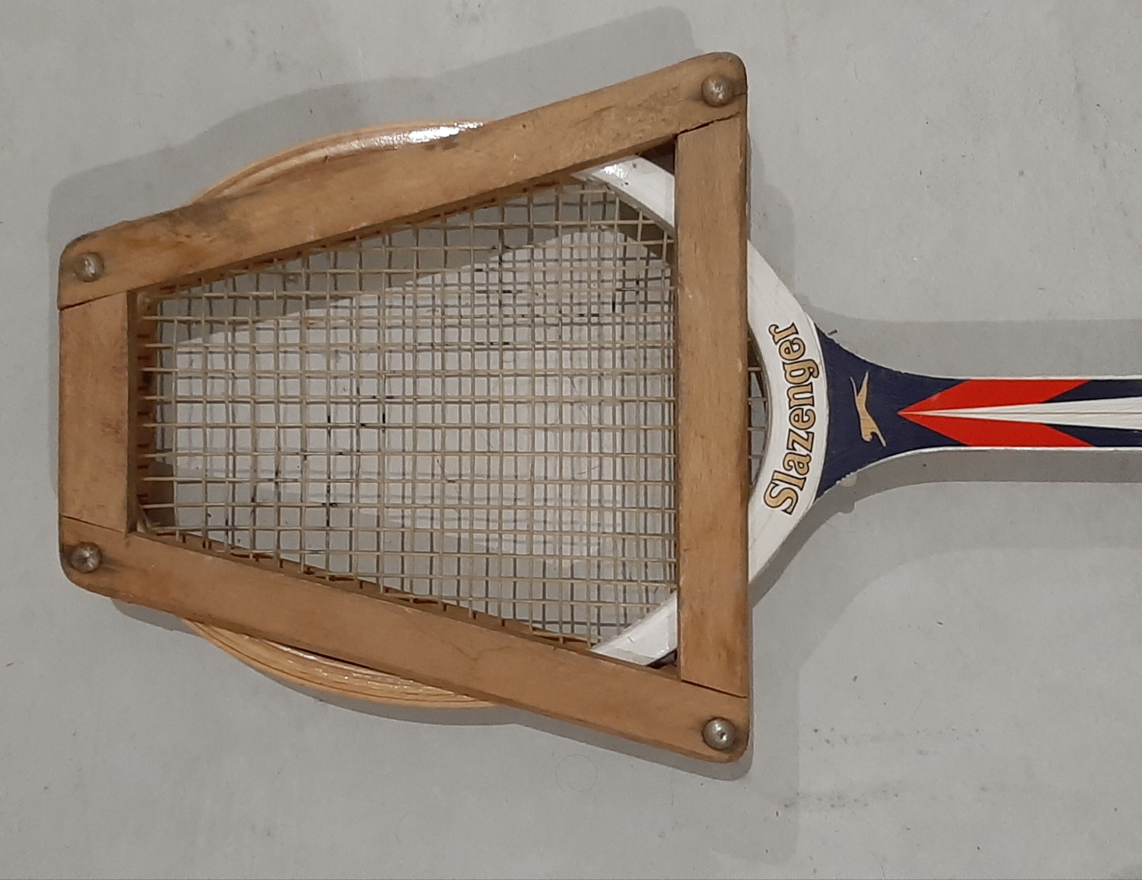 Vintage tennis racket slazenger and its wood frame