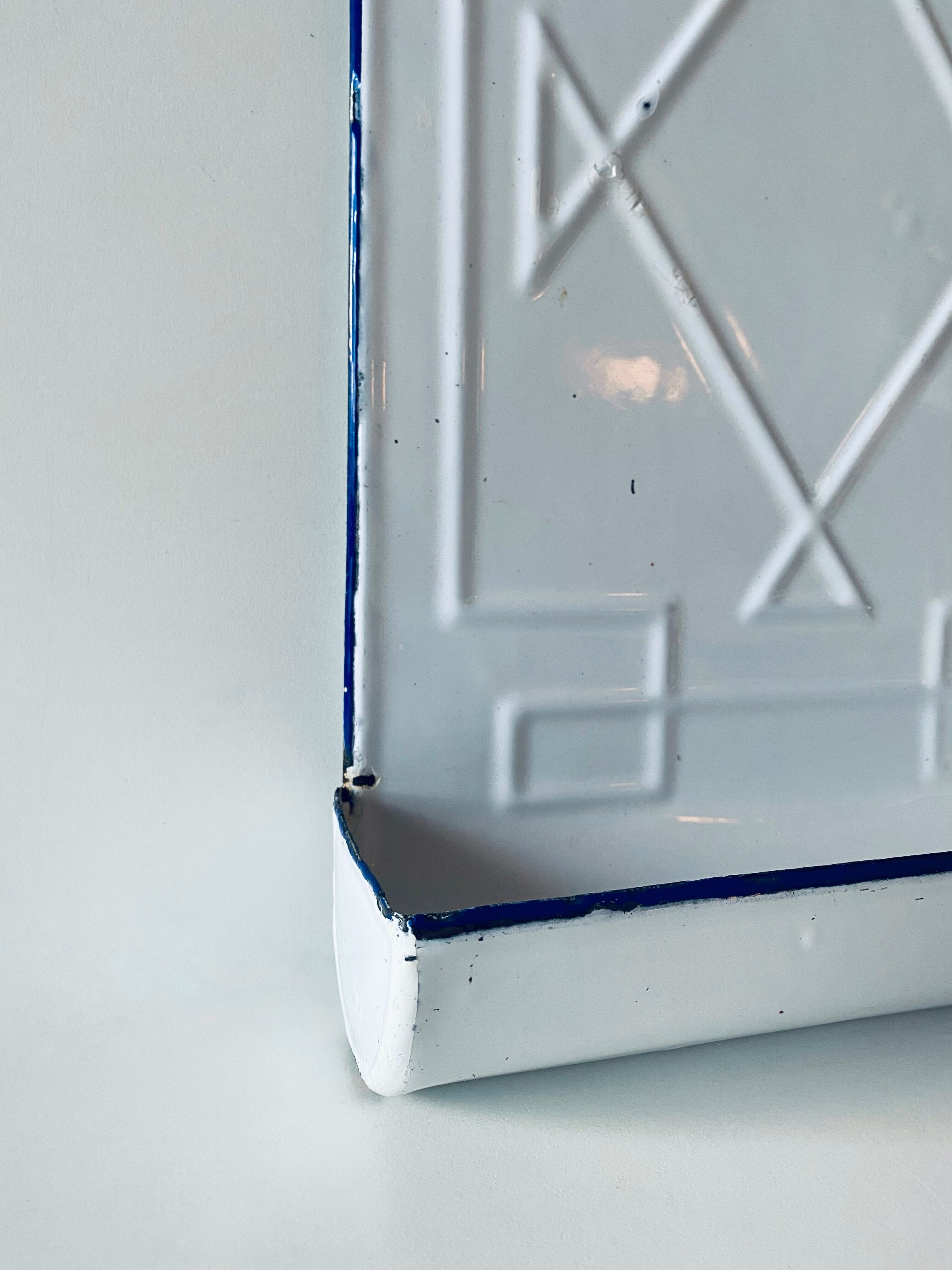 Old enamelled kitchen utensil display