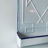 Old enamelled kitchen utensil display