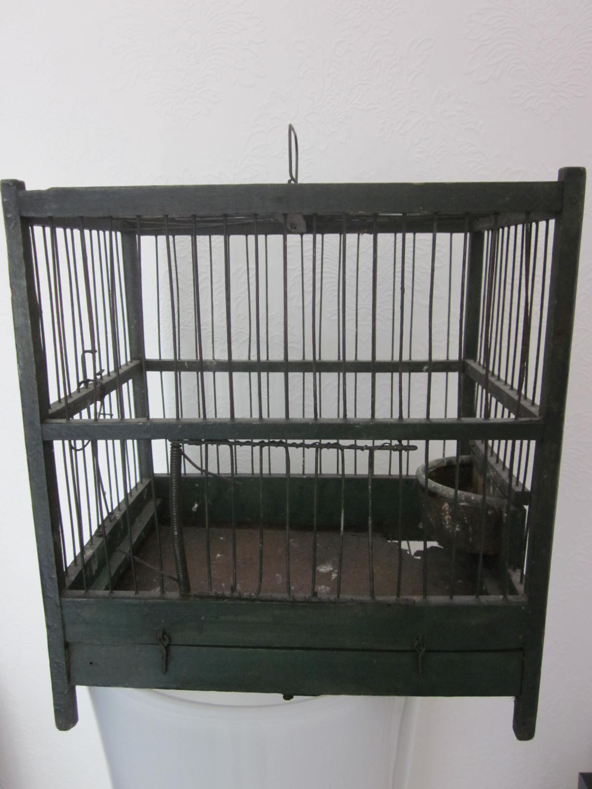 Wooden bird cage with feeder