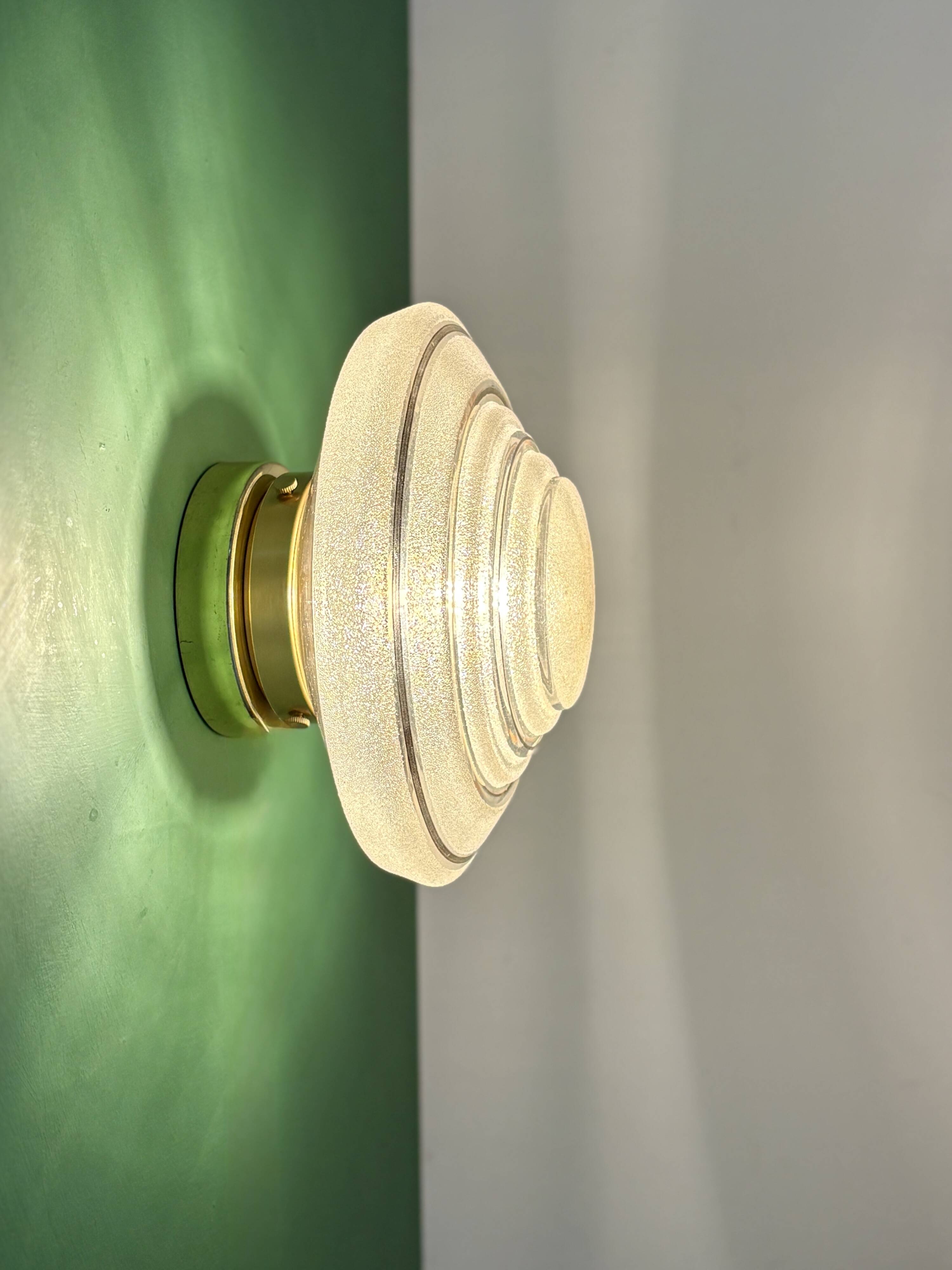 Old glass globe wall/ceiling light in frosted white and gold.