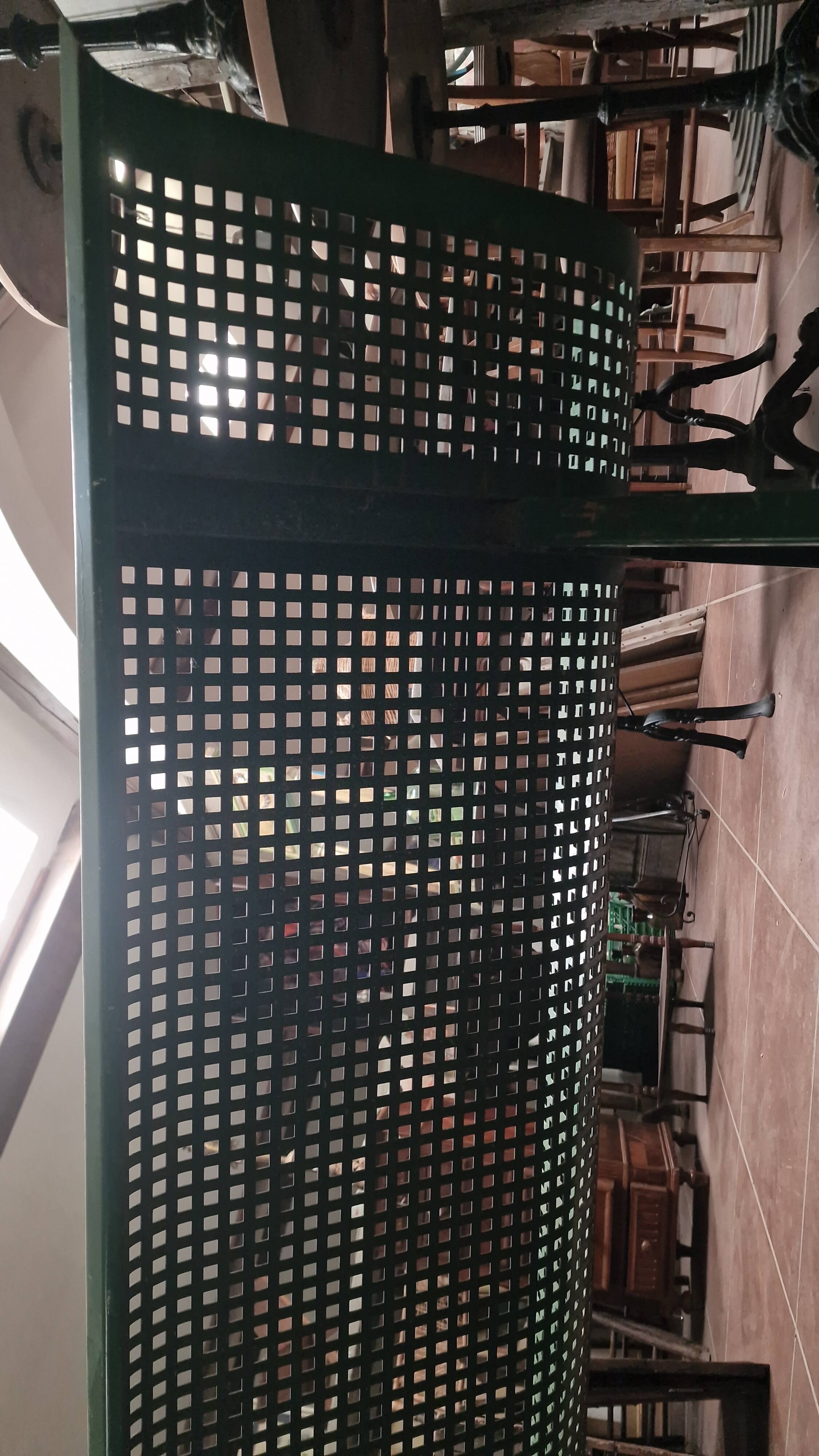 Vintage green perforated metal public bench