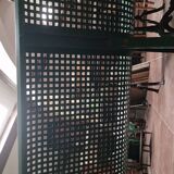Vintage green perforated metal public bench