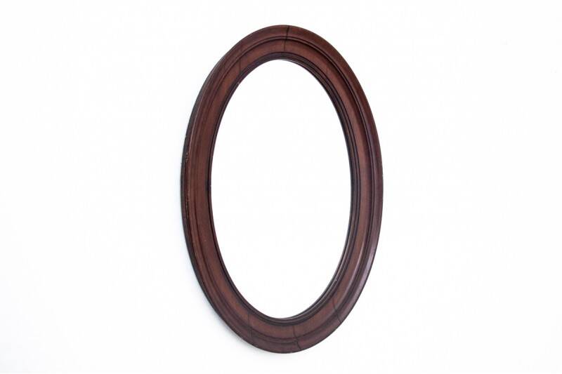 Oval mirror in a mahogany frame, Northern Europe, late 19th century.