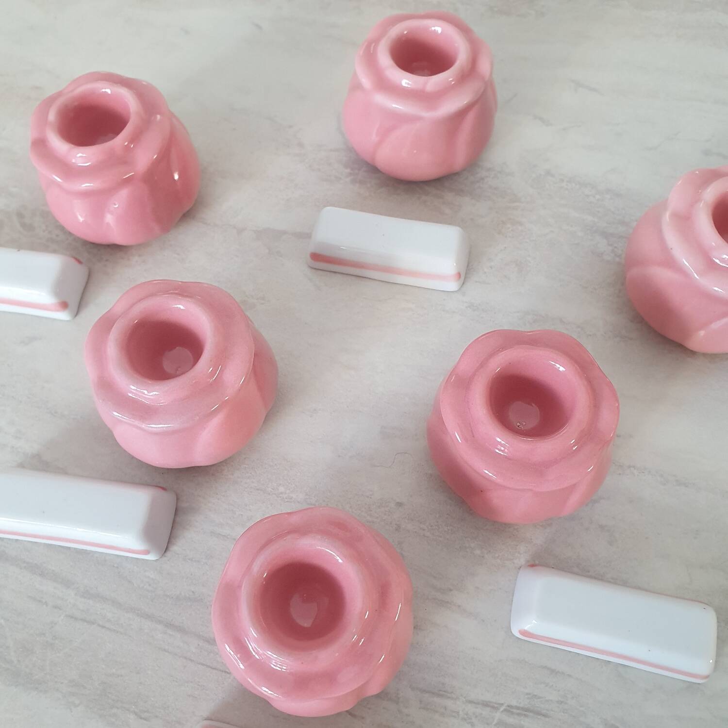 Pink candlesticks and porcelain knife holders