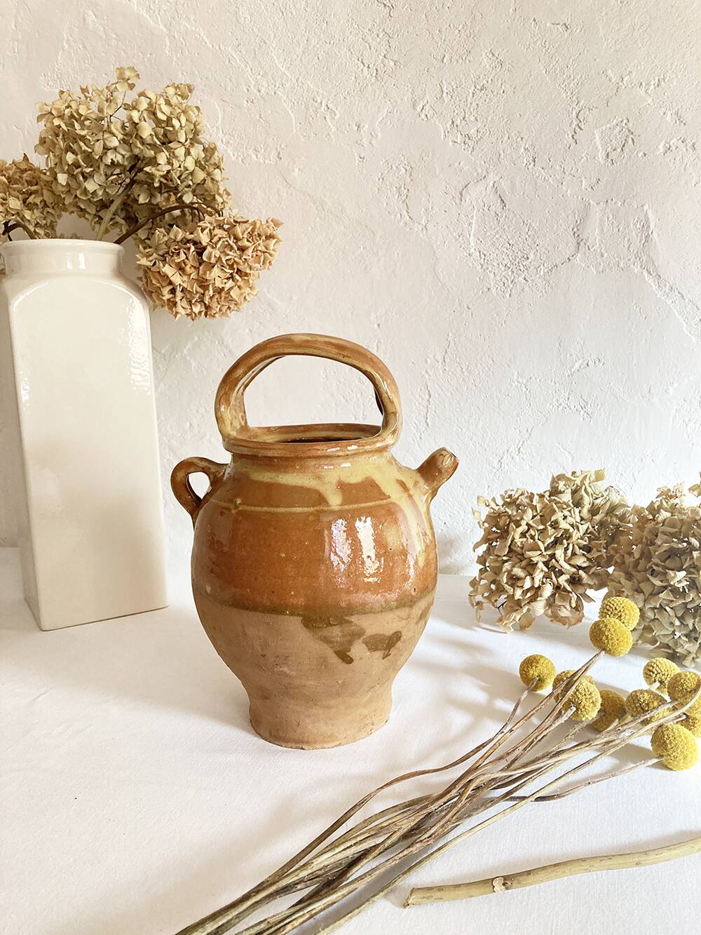 Old ochre and yellow glazed ceramic jug / goat