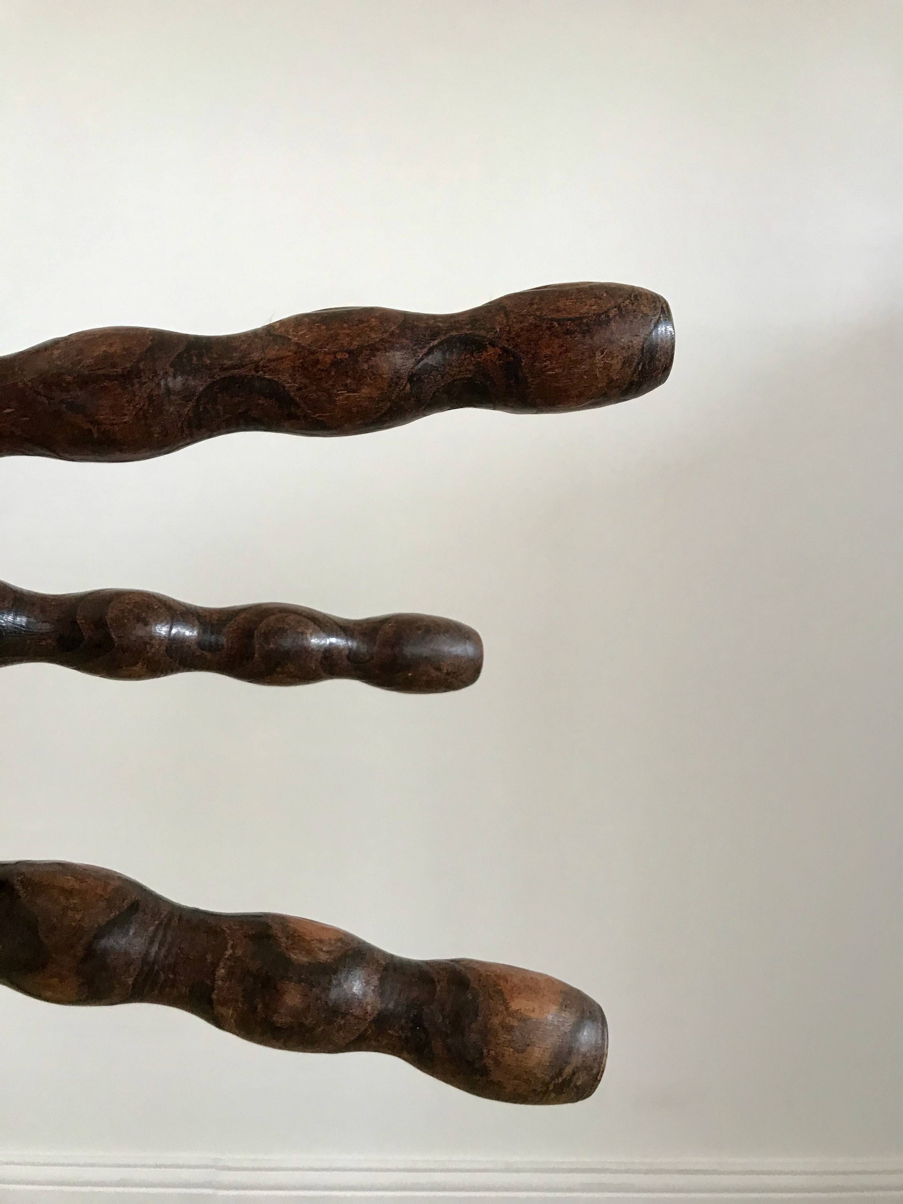 low stool in solid turned wood from the 70s