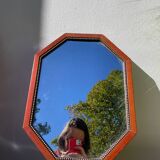 Octagonal beaded wooden mirror