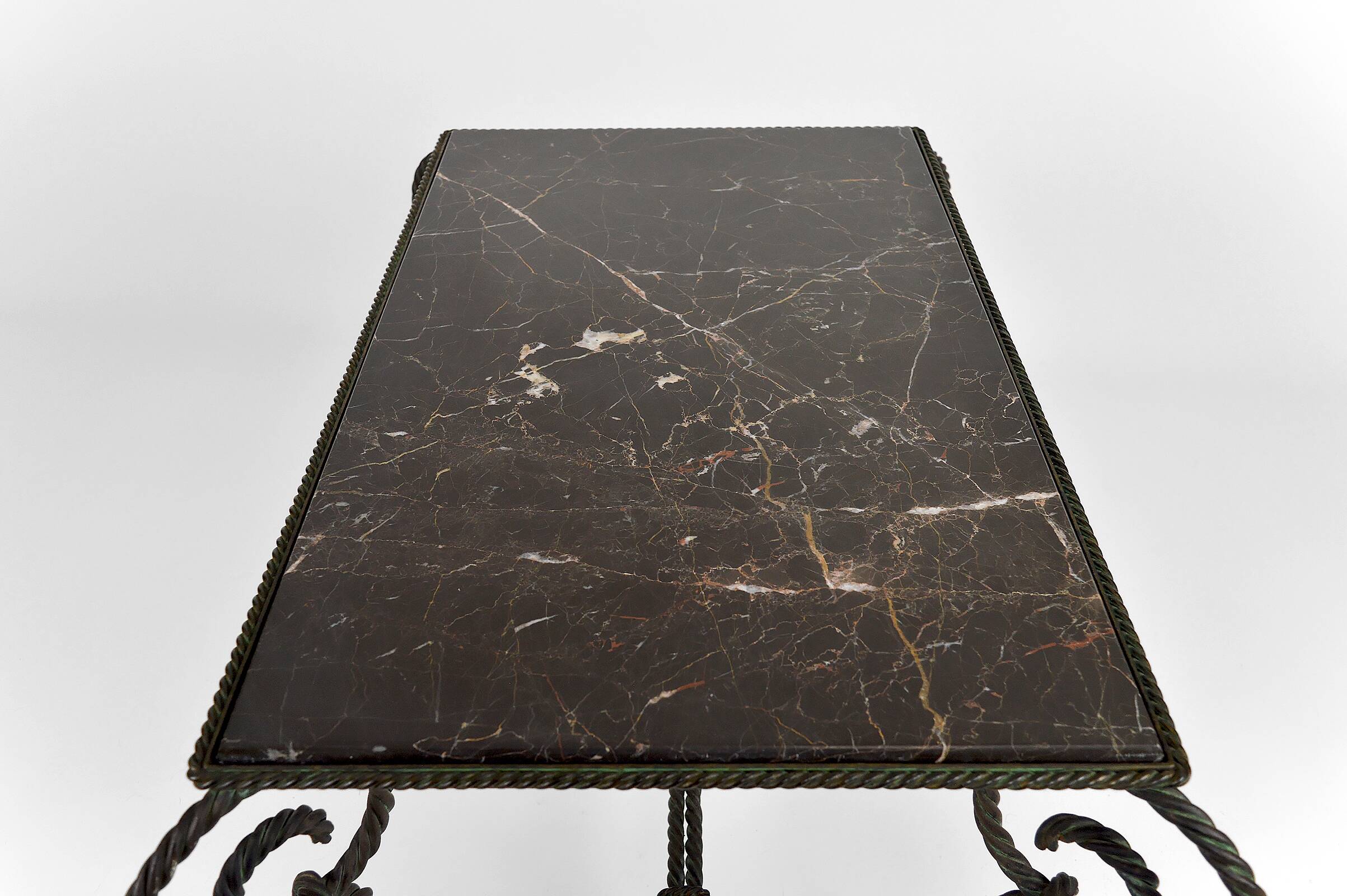 Coffee table in patinated wrought iron and black marble, circa 1940