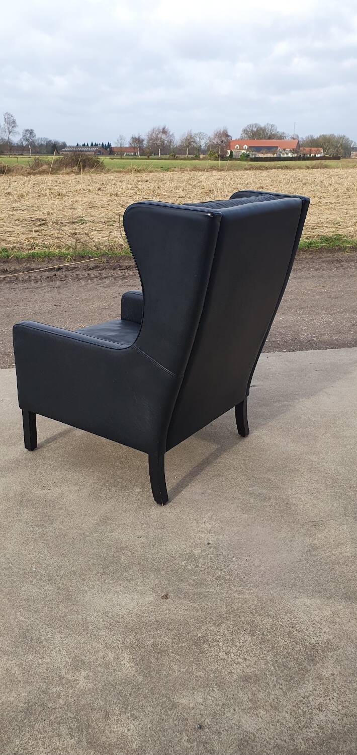 Vintage black leather scandinavian wingback chair Lulu Stouby
