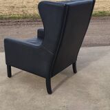 Vintage black leather scandinavian wingback chair Lulu Stouby