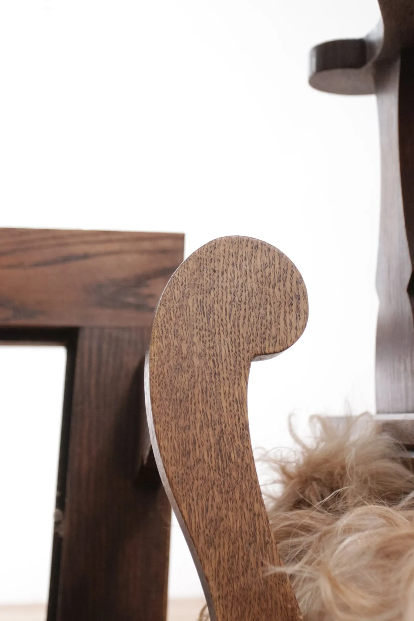 Pair of brutalist oak lounge chairs with rush seats, circa 1935