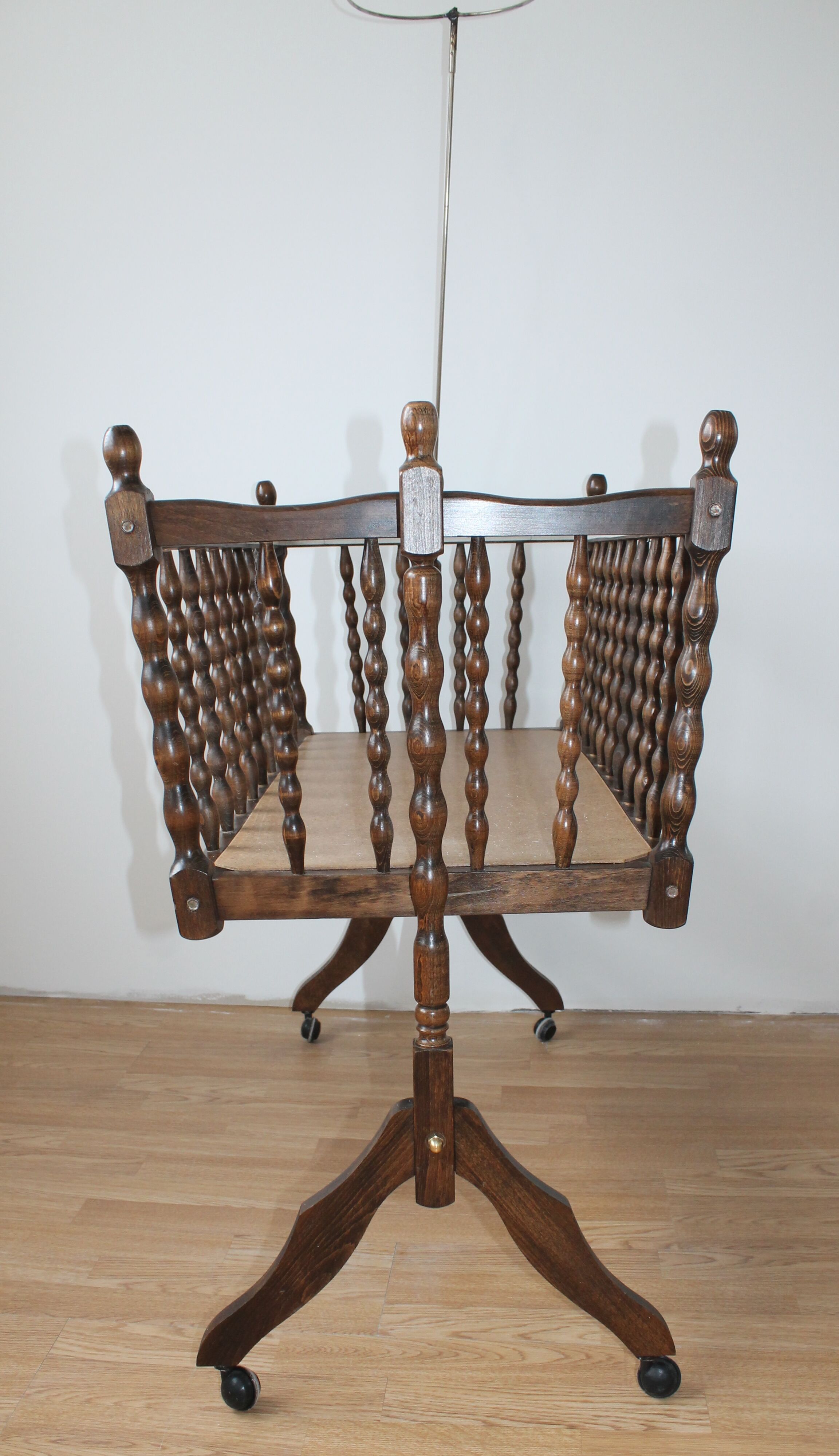 Old Vintage cradle with balance on wheels