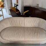 2 seater leather sofa in off-white with a rounded shape