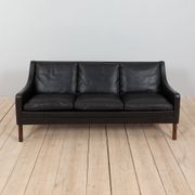 Danish black leather and rosewood sofa