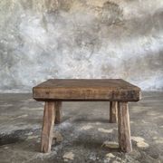 Small stool, rectangular solid teak side table with curved legs.