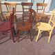 Set of 12 mismatched wooden bistro chairs