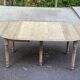 Round extendable dining table with flaps, stripped in raw oak, with 3 extensions.