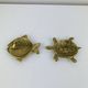Pair of animal trinket trays in brass, fish and turtle.