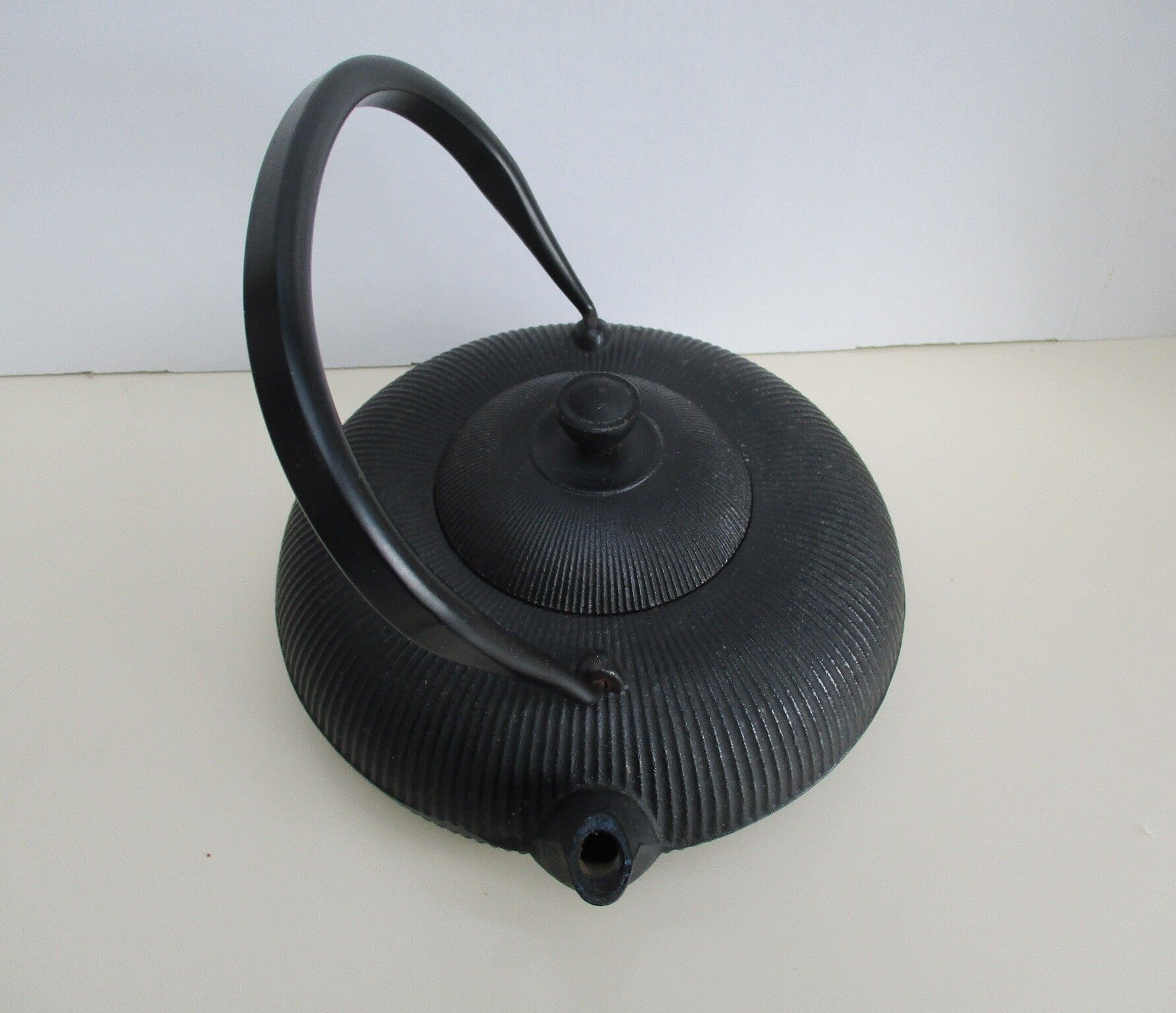 Asian teapot in black cast iron