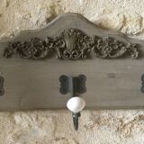 Wall-mounted wooden coat rack with 3 hooks.