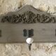 Wall-mounted wooden coat rack with 3 hooks.
