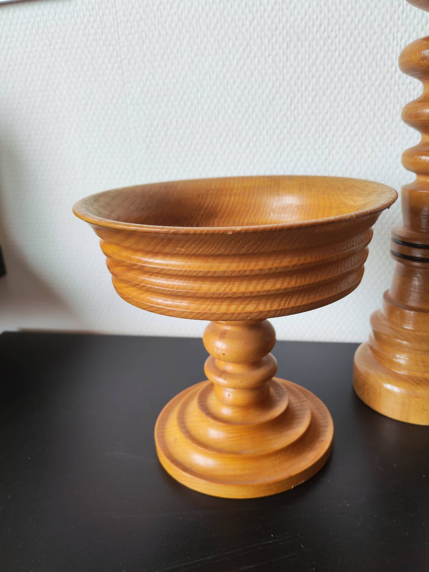 Vintage decor trio: candlestick and light wood bowls in Scandinavian style.