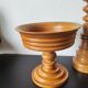 Vintage decor trio: candlestick and light wood bowls in Scandinavian style.