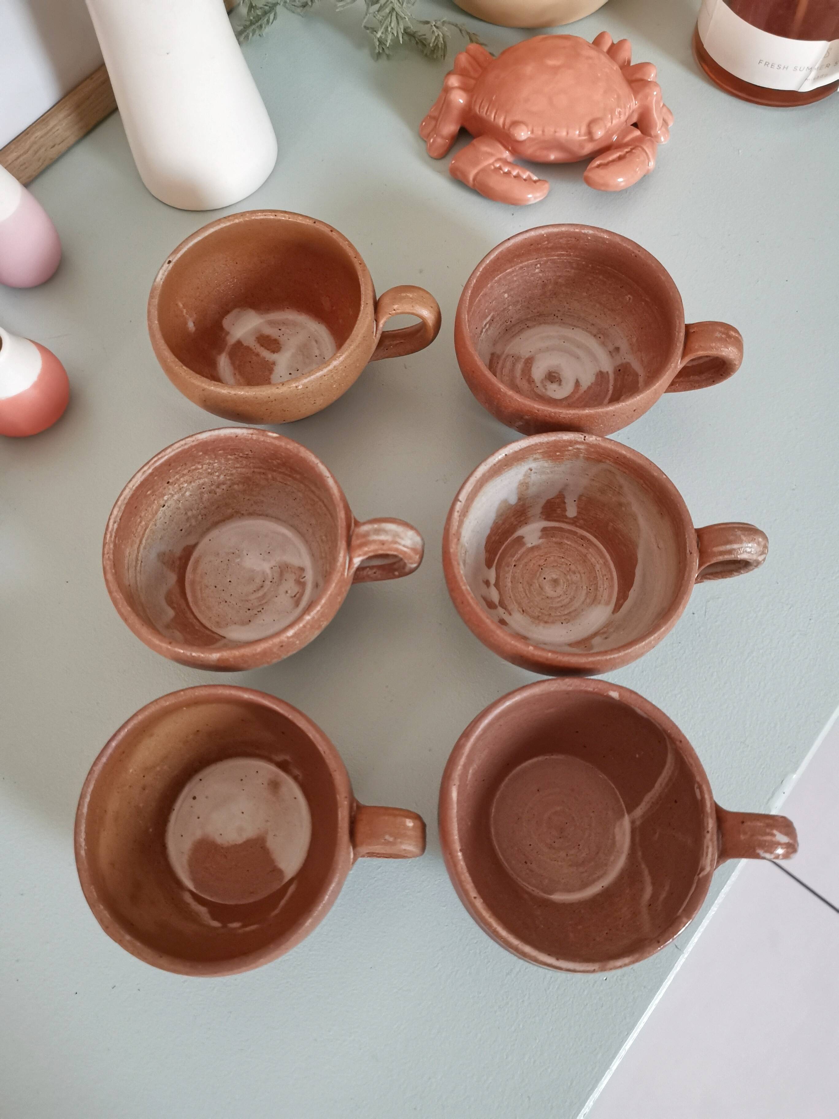 Set of vintage stoneware cups and saucers