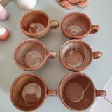 Set of vintage stoneware cups and saucers
