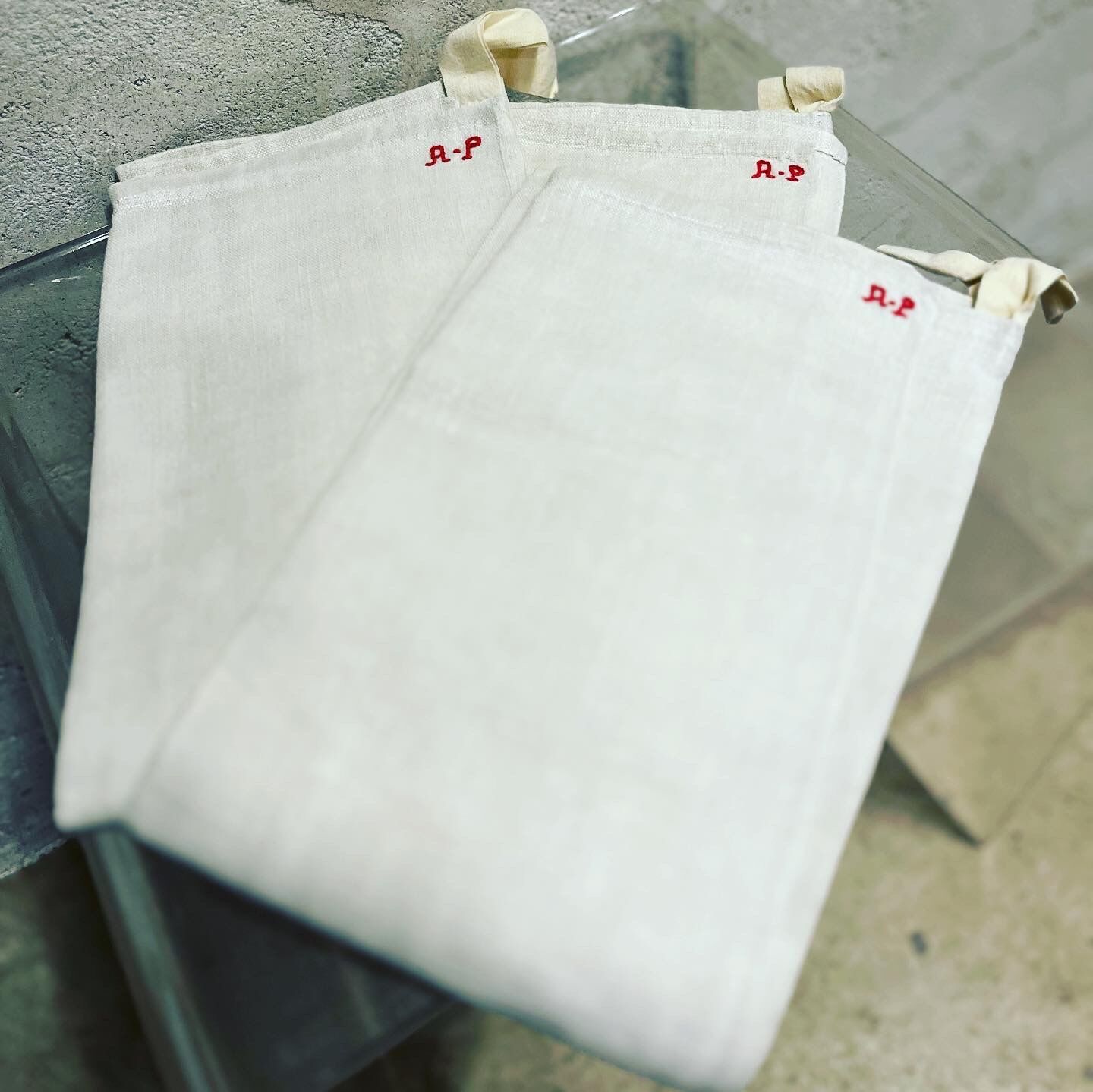 New linen tea towels embroidered AP