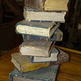 side table, end of sofa stack of wooden books, old, beautiful patina