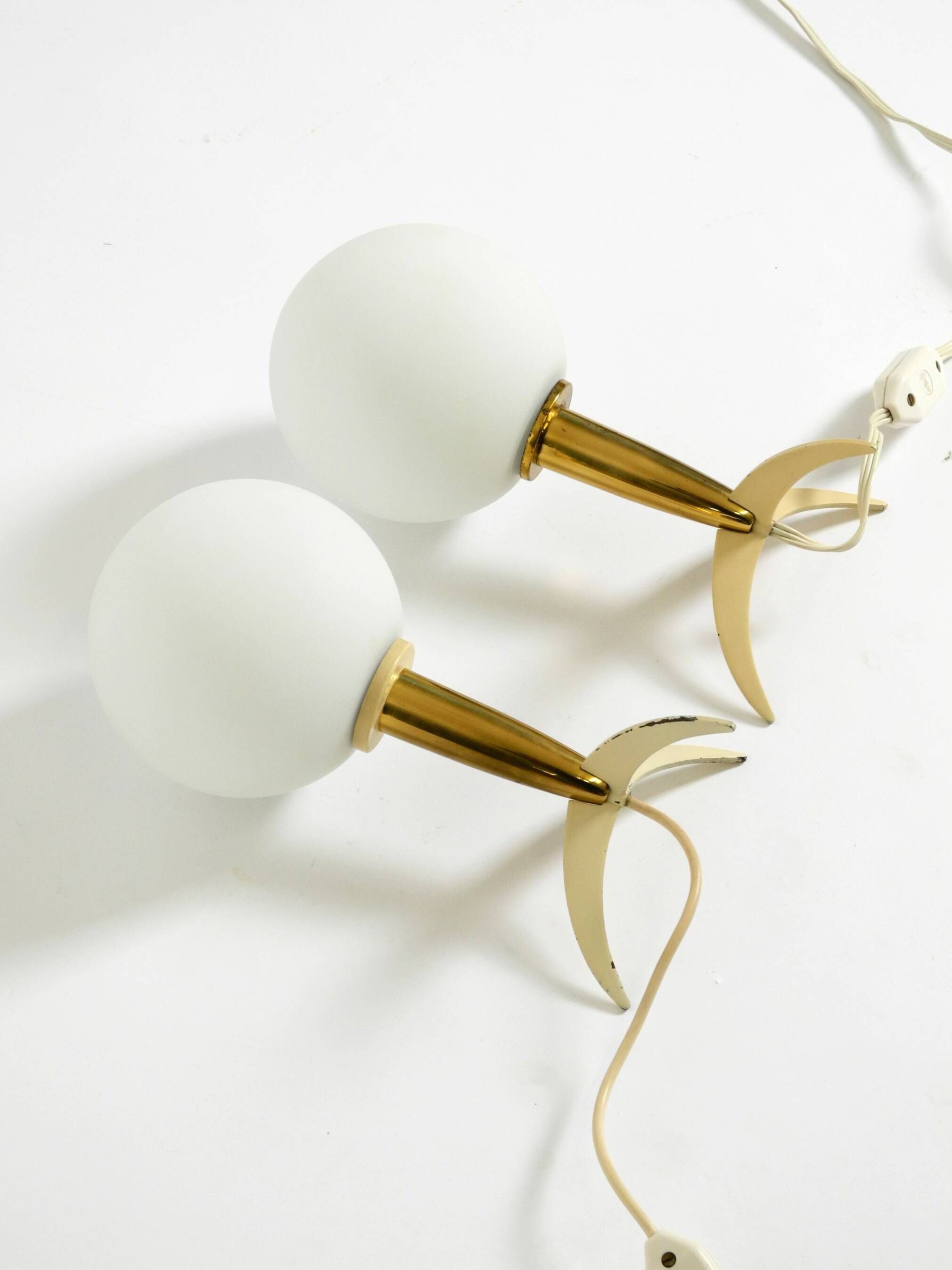 Two Mid-Century Modern rocket table lamps in brass and glass