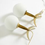 Two Mid-Century Modern rocket table lamps in brass and glass