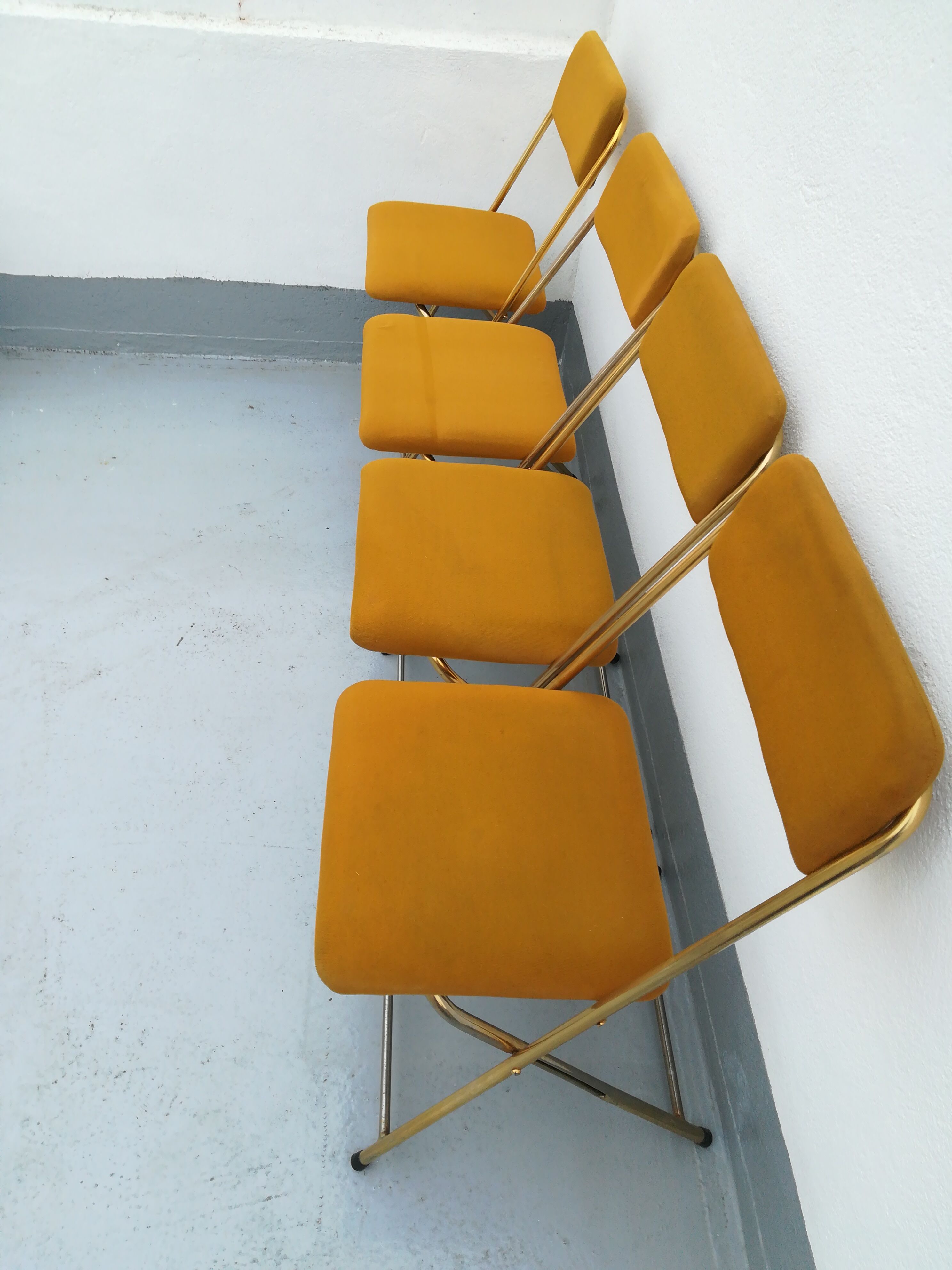 4 folding gold vintage Eyrel chairs