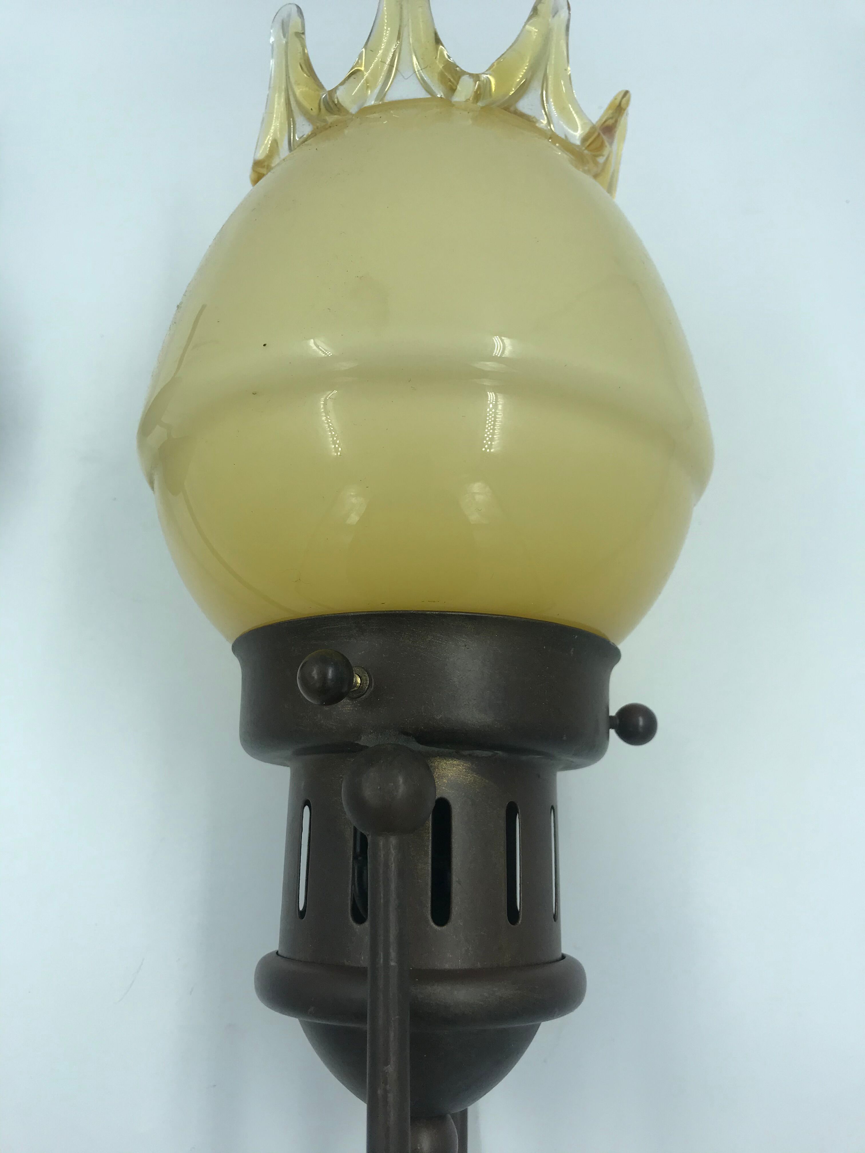 Decorative glass and metal wall light