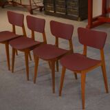 Set of 4 designer chairs in oak and red leatherette from the 1960s