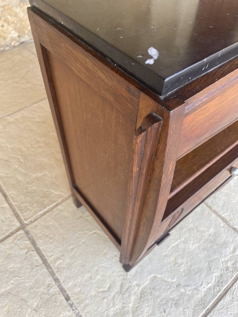 Art Deco bedside table in walnut, black marble top, circa 1920.