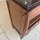 Art Deco bedside table in walnut, black marble top, circa 1920.