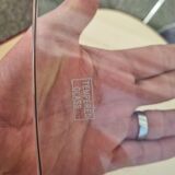 Guzzini dining set, round glass table and 4 shell chairs.