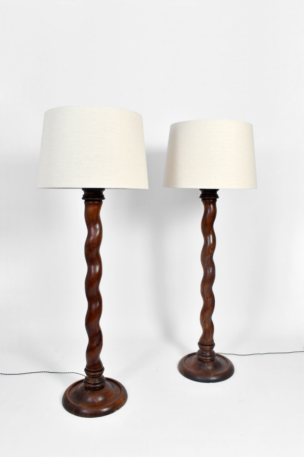 Pair of wooden floor lamps, 1920s.