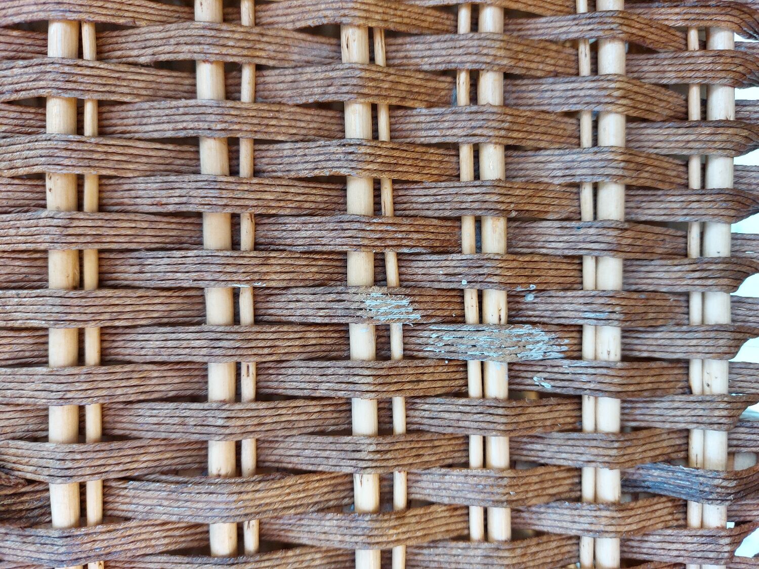 Wicker chest of drawers and rope