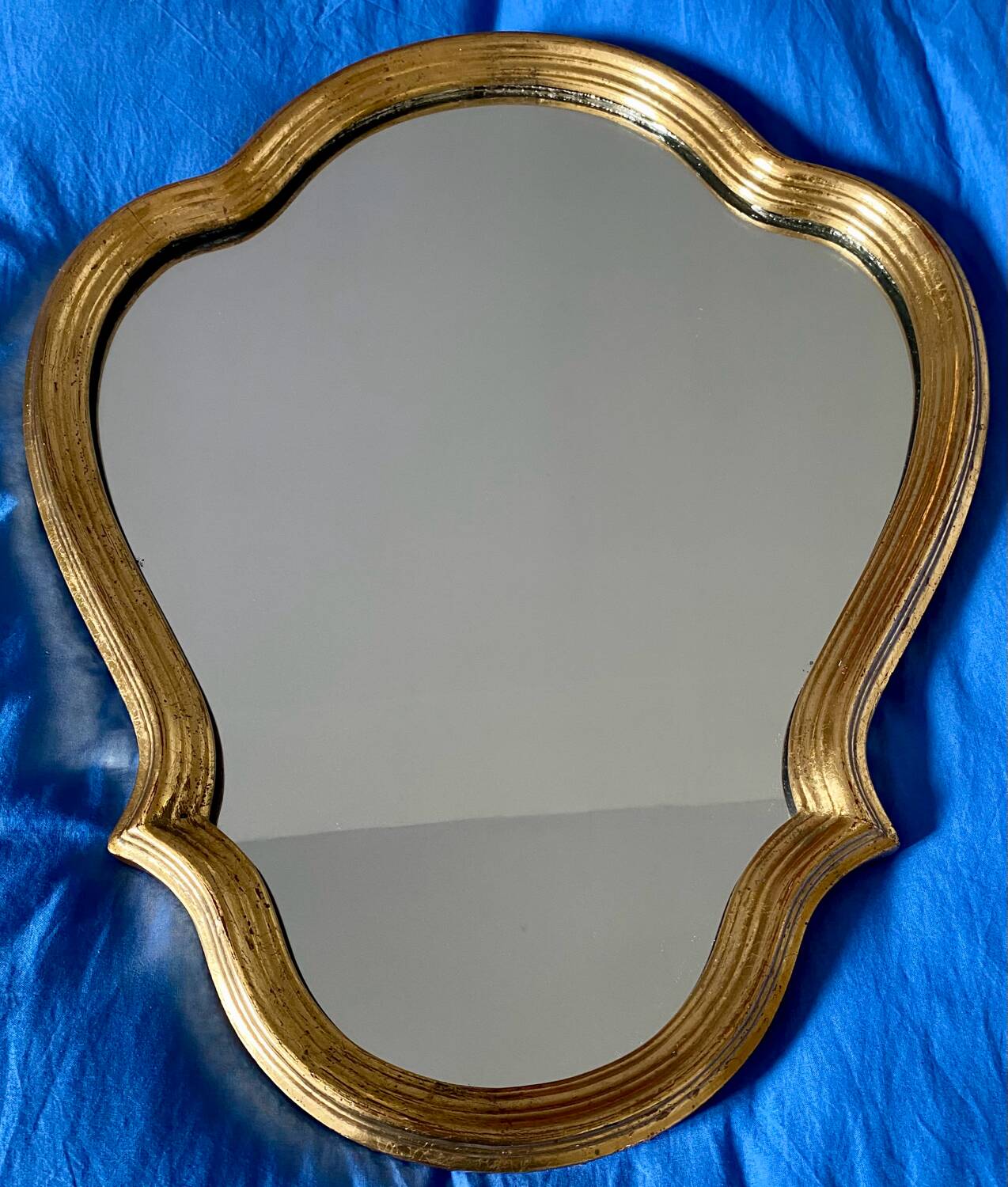 Wall mirror in a gilded wooden frame