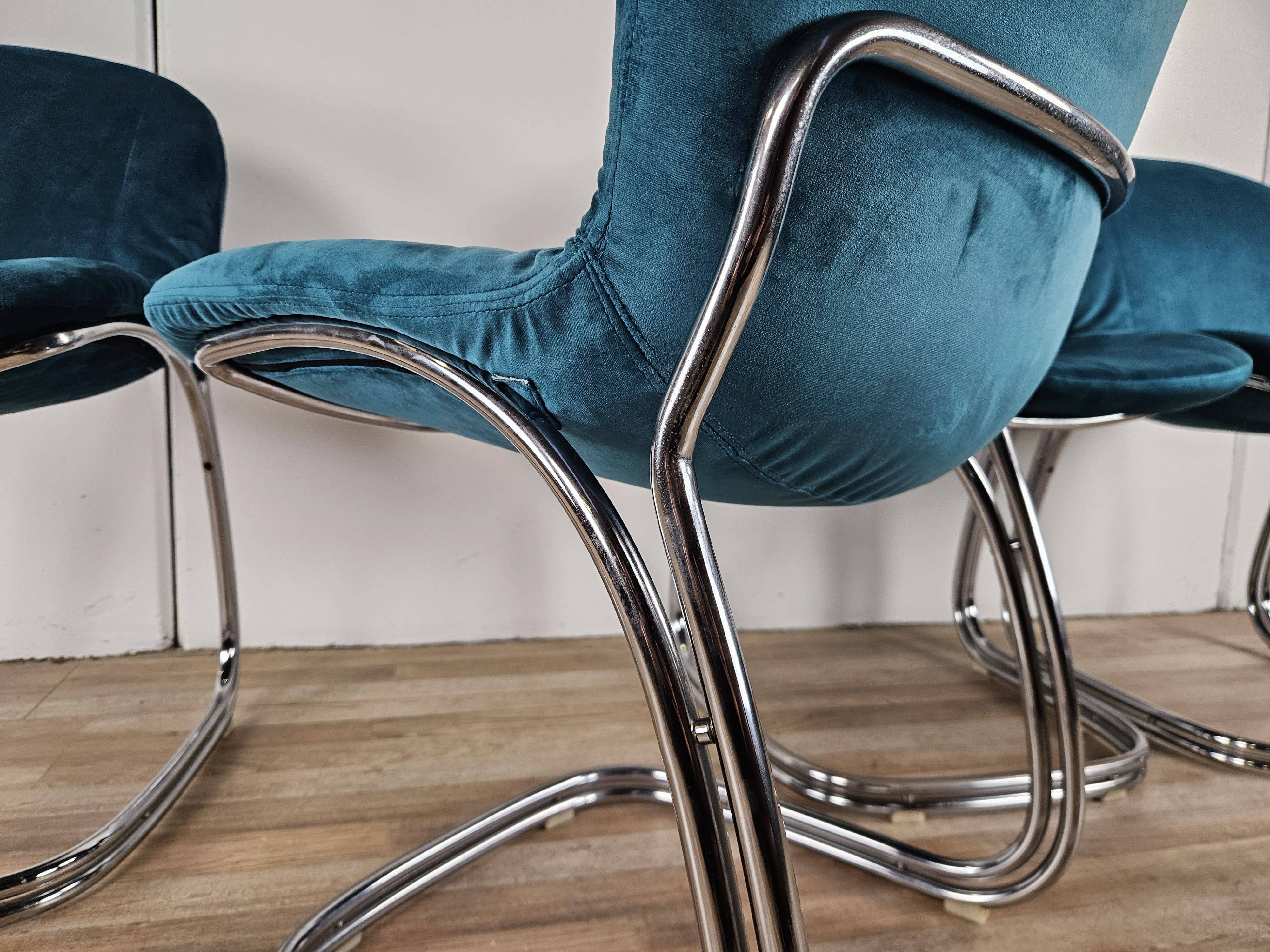Four 1970s tubular chairs upholstered in blue velvet